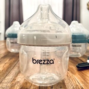 (8) Baby Brezza Bottles + accessories